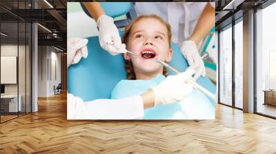 Little girl visiting dentist Wall mural