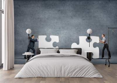 Piece of puzzle and business persons Wall mural