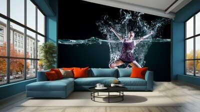 Professional woman swimmer on a wave Wall mural