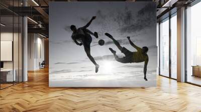 silhouettes of two soccer players Wall mural