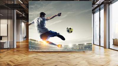 Soccer player at stadium. Mixed media Wall mural