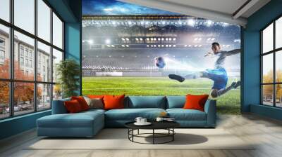 Soccer player on stadium in action. Mixed media Wall mural