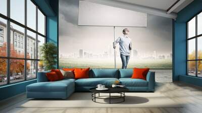 Teenager with banner Wall mural