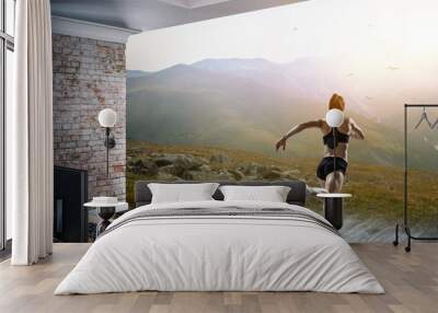 Woman running against natural landscape Wall mural