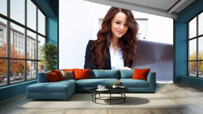 Young busines woman with notebook Wall mural