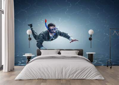 Young businessman in suit swimming Wall mural