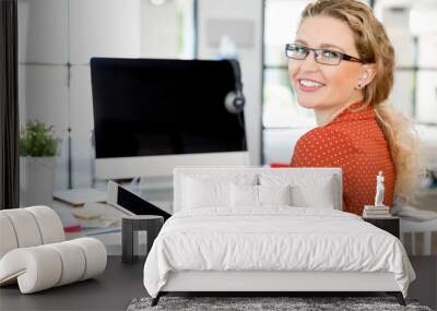 Young woman in office Wall mural