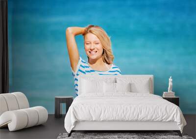 Young woman relaxing on the beach Wall mural