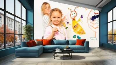 Cute little girls with brushes drawing funny bugs Wall mural