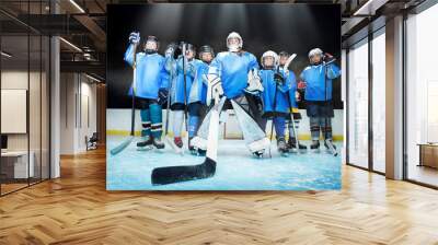 Ice hockey team standing in line on the rink Wall mural