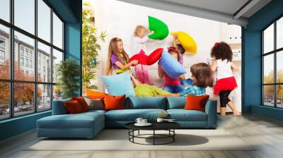 Kids playing pillow fight Wall mural