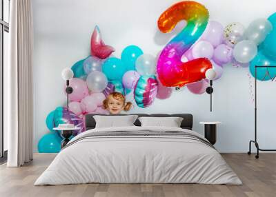 Little girl stand over birthday balloons decorations Wall mural