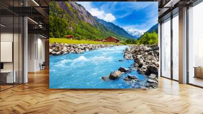 Swiss landscape with river stream and houses Wall mural