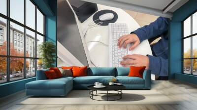 person typing on keyboard, Close-up of technologies used - hands using keyboard, computer mouse Wall mural