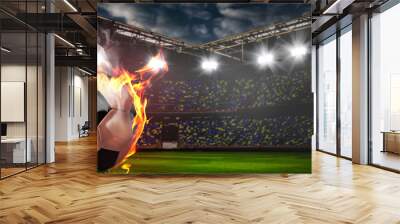 Soccer or football ball on fire at stadium Wall mural