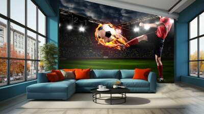 soccer or football player is kicking ball on stadium Wall mural