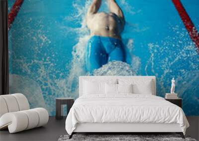 Photo on top of man swimming on back in swimming pool Wall mural