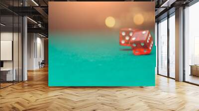 Red dices on green table, background with lights, blank background for text Wall mural