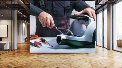 Repairman repairs of vacuum cleaner. Repairing cleaner.Small business. Wall mural