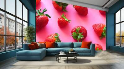 Ripe juicy and fragrant strawberries on a bright pink background Wall mural