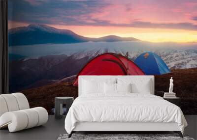 Tourist camping in autumn mountains. Two tents on nacbkground of sunrise Wall mural