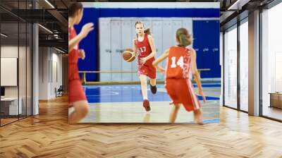 Girls athlete in sport uniform playing basketball Wall mural