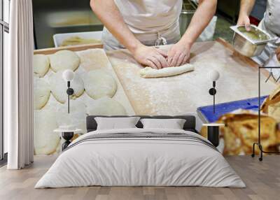 Kneading dough in bakery Wall mural