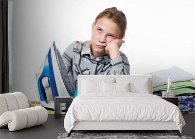 Tired girl with washed linen around ironing board and iron isola Wall mural