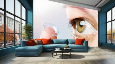 Womans eye and contact lens Wall mural