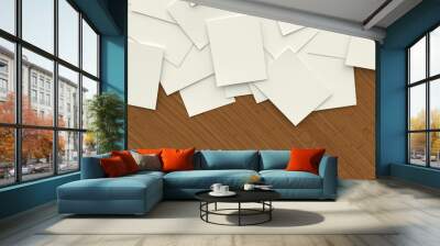 Scattered sheets of paper on a wooden table Wall mural