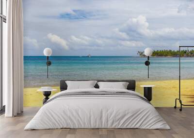 sea surf on the beach. Sand, sea, blue sky and white clouds Wall mural