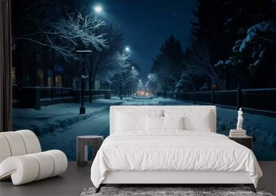 Snowy nighttime street scene illuminated by streetlights with soft snowfall in a peaceful neighborhood Wall mural