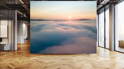 Sunrise over the fog in the Ukrainian Carpathians. Aerial drone view. Wall mural