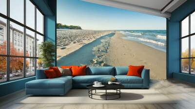 A view out to sea along the shoreline on a quiet beach on a bright sunny day Wall mural