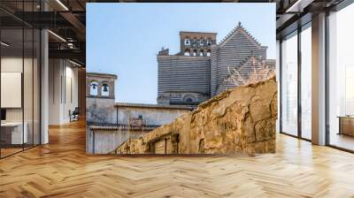 View of the back wall of the 14th-century Roman catholic cathedral Duomo di Orvieto, or Cattedrale di Santa Maria Assunta with bell towers, in Orvieto, Umbria, Italy Wall mural