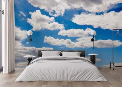 White clouds in a blue sky Wall mural