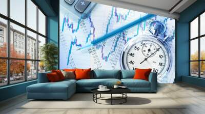 Candlestick graph chart and stopwatch Wall mural