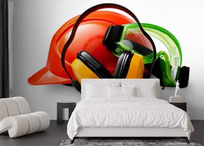 Red safety helmet with earphones and goggles Wall mural