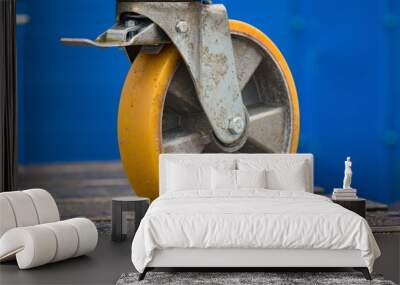 Yellow wheel on a blue background Wall mural