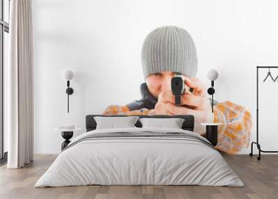 Young man is aiming with gun Wall mural