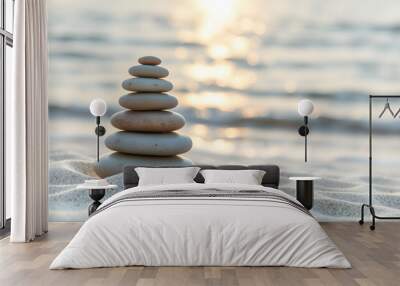 Zen pyramid of spa stones on the blurred sea background. Sand on a beach. Sea shores. Place for text isolated with white highlights, png Wall mural