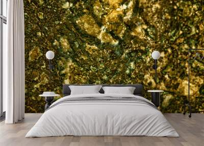 Abstract golden background. Gold natural mineral. Macro photo of the precious stone. Wall mural