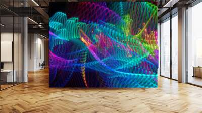 light painting photography, waves of vibrant color against a black background. Long exposure photo of vibrant fairy lights in abstract Wall mural