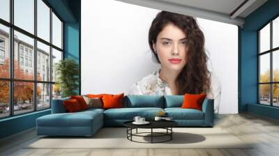 Beauty portrait of young adorable fresh looking brunette woman with long brown healthy curly hair. Emotion and facial expression lifestyle concept. Wall mural