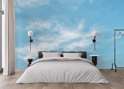 Light cirrus clouds on light blue sky Wall mural