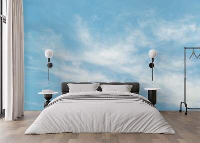 Light cirrus clouds on light blue sky Wall mural