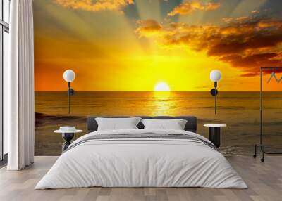 Majestic bright sunrise over ocean and light waves Wall mural