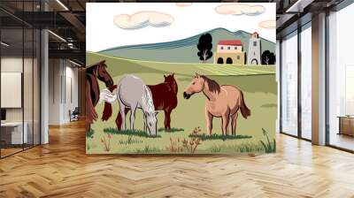 Horses peacefully grazing in a meadow. Wall mural