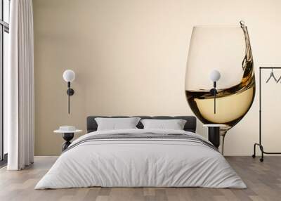 Suspended drops and splash of white wine in glass Wall mural