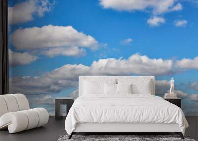 Blue sky with white floating clouds at daytime. Wall mural